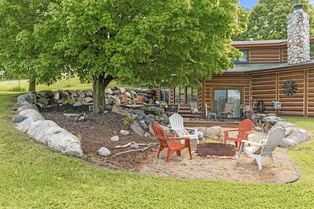 22165 Harlow Ave, Helena Twp, MN 55352 - view of green lawn featuring a fire pit and a patio area