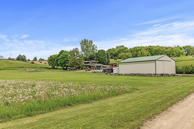 22165 Harlow Ave, Helena Twp, MN 55352 - view of grassy yard with an outdoor structure and an outbuilding