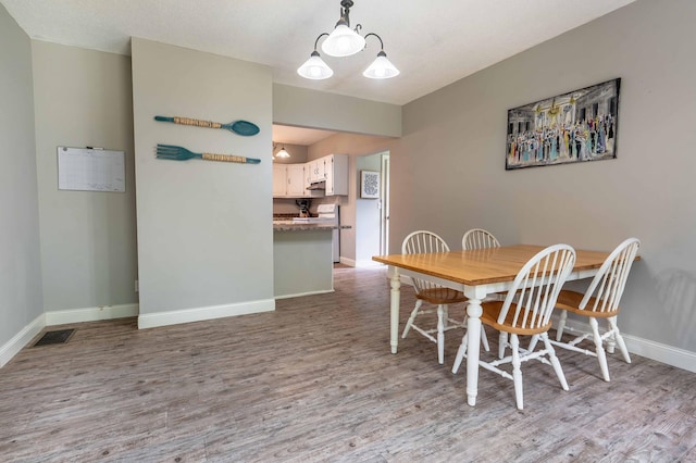 113 7th Ave SE, Elbow Lake, MN 56531 - dining area with wood finished floors and baseboards