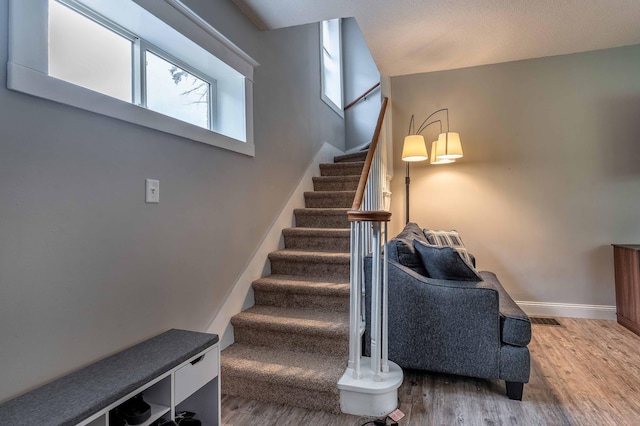 113 7th Ave SE, Elbow Lake, MN 56531 - stairs with wood finished floors and baseboards