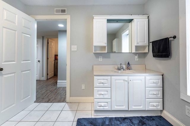 113 7th Ave SE, Elbow Lake, MN 56531 - bathroom with vanity, baseboards, and tile patterned flooring