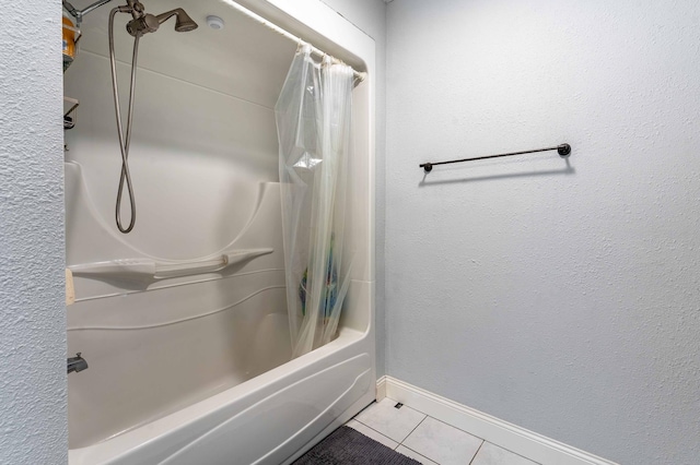 113 7th Ave SE, Elbow Lake, MN 56531 - full bathroom featuring tile patterned floors, shower / bath combo with shower curtain, and baseboards