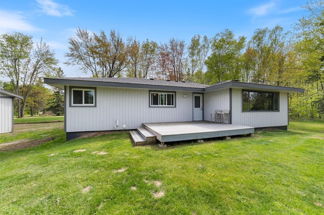 185 Wagon Rd, Esko, MN 55733 - rear view of property with a wooden deck and a lawn