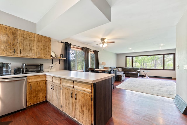 185 Wagon Rd, Esko, MN 55733 - kitchen with dishwasher, a peninsula, light countertops, dark wood-style flooring, and ceiling fan