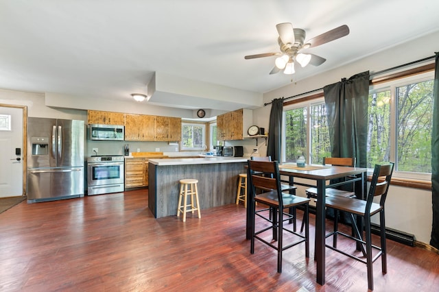 185 Wagon Rd, Esko, MN 55733 - dining area with ceiling fan and dark wood finished floors