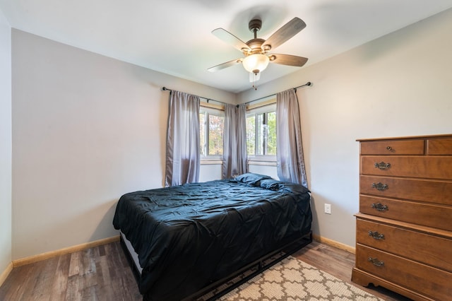 185 Wagon Rd, Esko, MN 55733 - bedroom featuring baseboards, light wood-style flooring, and a ceiling fan