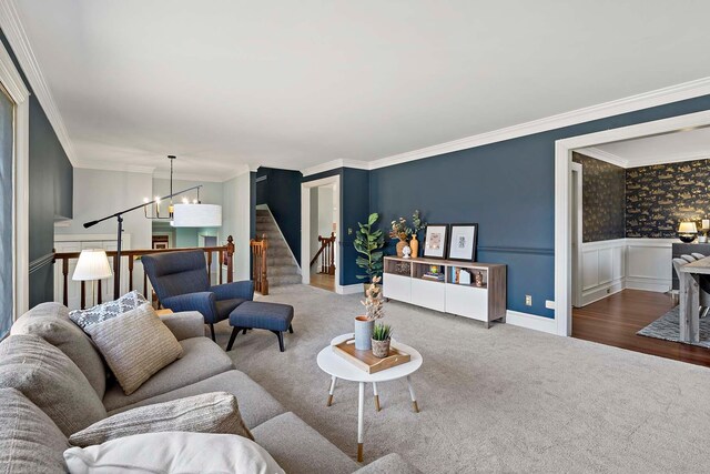 75 Oregon Ave S, Golden Valley, MN 55426 - carpeted living room featuring a chandelier, stairs, wainscoting, ornamental molding, and baseboards