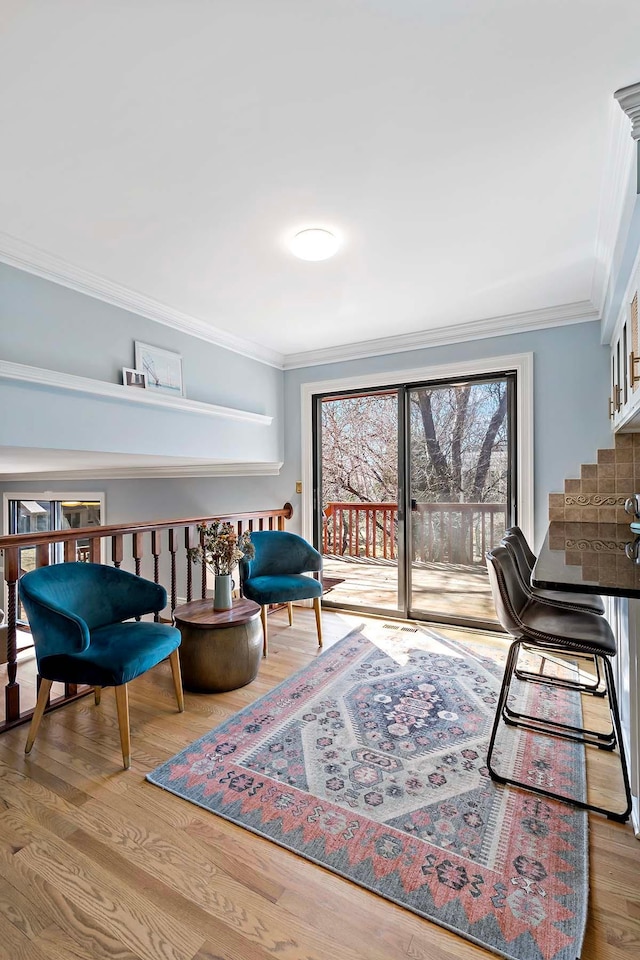 75 Oregon Ave S, Golden Valley, MN 55426 - sitting room with ornamental molding, wood finished floors, and stairway
