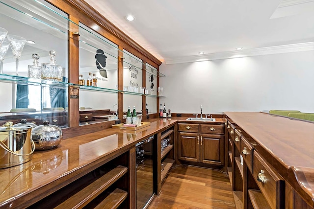 75 Oregon Ave S, Golden Valley, MN 55426 - indoor wet bar featuring wine cooler, crown molding, and wood finished floors