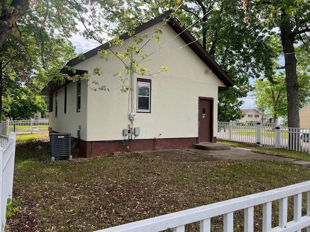 103 31st Ave N, Saint Cloud, MN 56303 - view of side of home featuring central AC and stucco siding