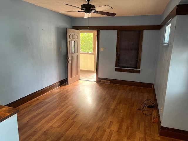 103 31st Ave N, Saint Cloud, MN 56303 - spare room featuring baseboards, wood finished floors, and a ceiling fan
