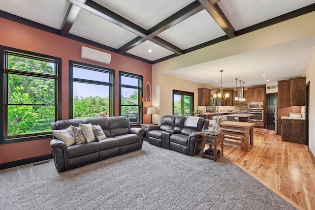 227 Maple Ln, Jordan, MN 55352 - living area with coffered ceiling, a chandelier, beamed ceiling, a wall unit AC, and light wood finished floors