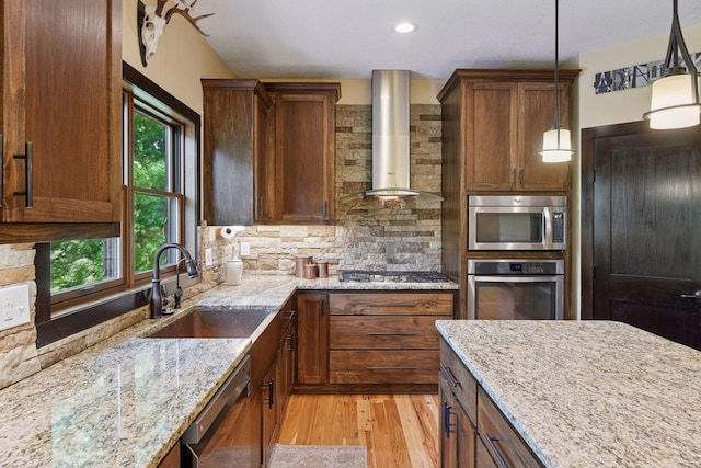 227 Maple Ln, Jordan, MN 55352 - kitchen featuring appliances with stainless steel finishes, wall chimney range hood, a sink, plenty of natural light, and recessed lighting