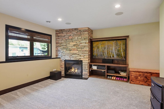 227 Maple Ln, Jordan, MN 55352 - living room featuring carpet, a fireplace, and recessed lighting