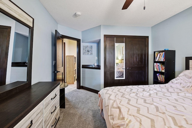 227 Maple Ln, Jordan, MN 55352 - bedroom featuring carpet, a closet, ceiling fan, and a textured ceiling