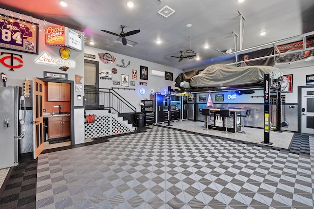 227 Maple Ln, Jordan, MN 55352 - garage with a ceiling fan, freestanding refrigerator, recessed lighting, and a sink