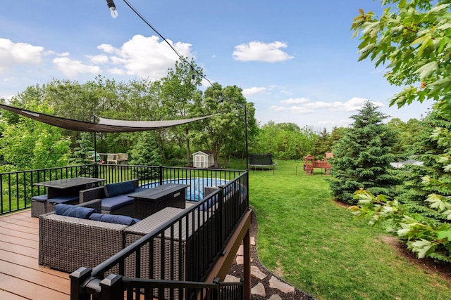 227 Maple Ln, Jordan, MN 55352 - wooden terrace featuring a trampoline, an outdoor hangout area, a playground, a yard, and view of scattered trees