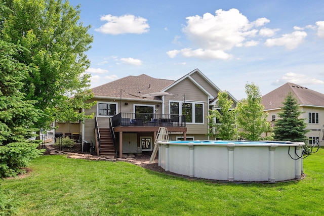 227 Maple Ln, Jordan, MN 55352 - rear view of house with stairway, a deck, a lawn, and an outdoor pool