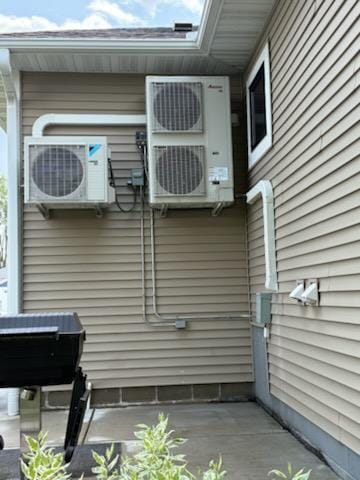 227 Maple Ln, Jordan, MN 55352 - view of side of home with ac unit