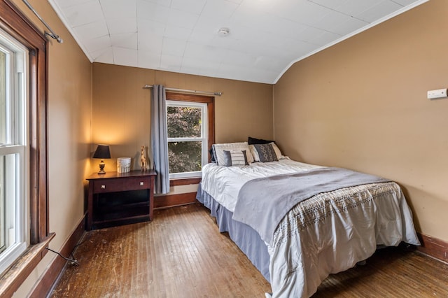 473 4th St, Winona, MN 55987 - bedroom with wood-type flooring, crown molding, and baseboards