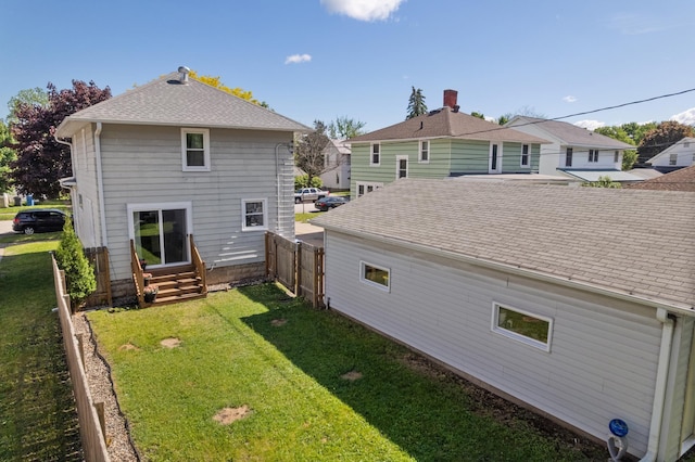 473 4th St, Winona, MN 55987 - back of house featuring entry steps and a shingled roof