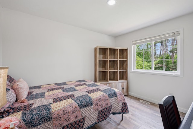 13171 Island View Dr NW, Elk River, MN 55330 - bedroom with light wood-style flooring and recessed lighting