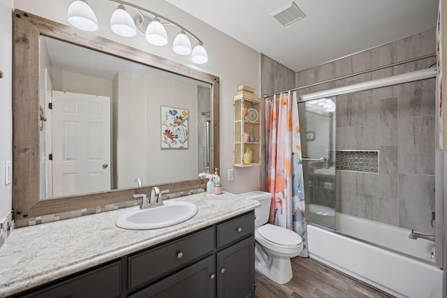 13171 Island View Dr NW, Elk River, MN 55330 - full bathroom featuring vanity, shower / bath combo with shower curtain, and wood finished floors