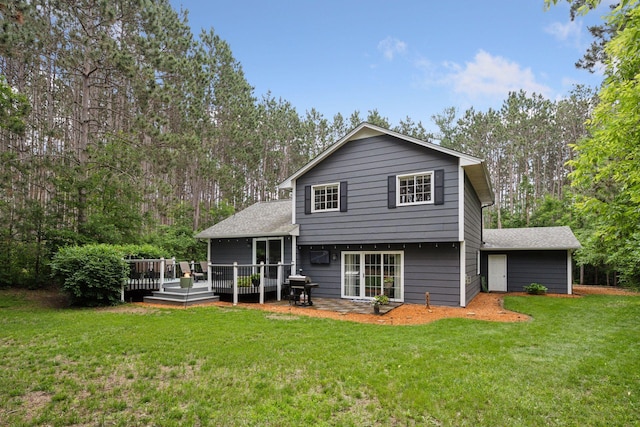 13171 Island View Dr NW, Elk River, MN 55330 - back of house featuring a yard, a wooden deck, and view of wooded area