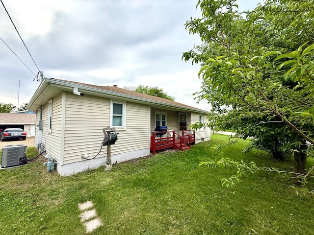 1402 Kirkwood Ave, Albert Lea, MN 56007 - back of property featuring a lawn and central AC