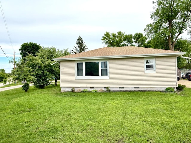 1402 Kirkwood Ave, Albert Lea, MN 56007 - view of property exterior featuring crawl space, a lawn, and a shingled roof