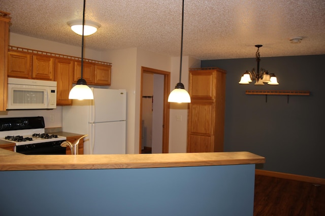 7642 Palisades Ave NE, Otsego, MN 55330 - kitchen featuring white appliances, a textured ceiling, brown cabinets, dark wood-type flooring, and a chandelier