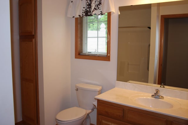 7642 Palisades Ave NE, Otsego, MN 55330 - bathroom featuring toilet, vanity, and a shower