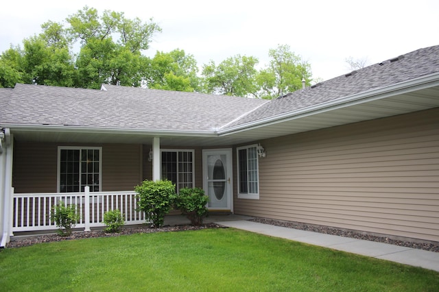 7642 Palisades Ave NE, Otsego, MN 55330 - doorway to property with roof with shingles, a yard, and covered porch