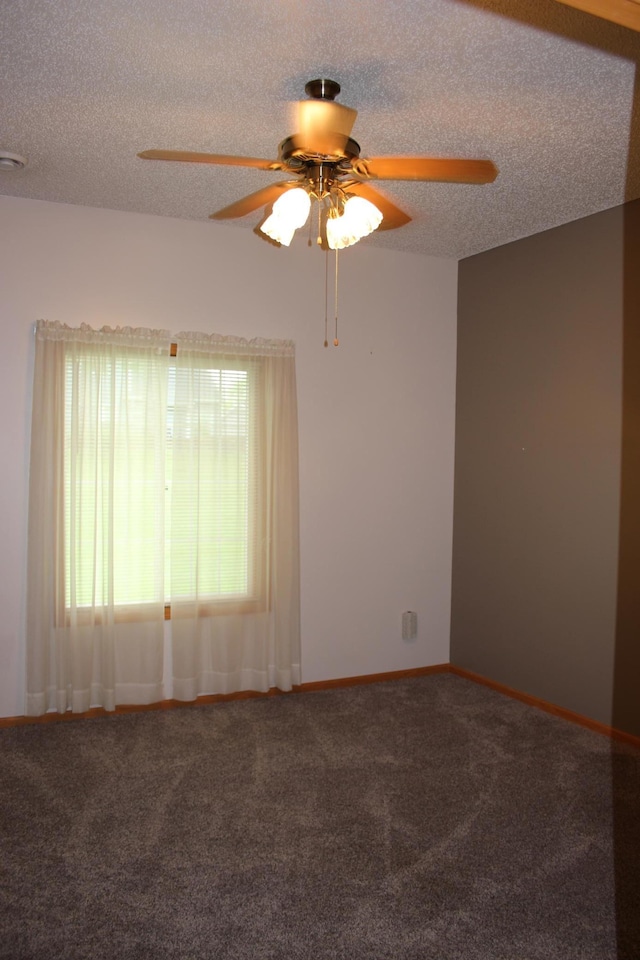 7642 Palisades Ave NE, Otsego, MN 55330 - empty room featuring ceiling fan, carpet flooring, a textured ceiling, and baseboards