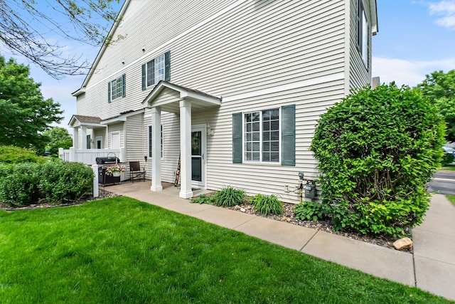 13055 Europa Trail Way N Unit A, Hugo, MN 55038 - rear view of house featuring a lawn and a patio area