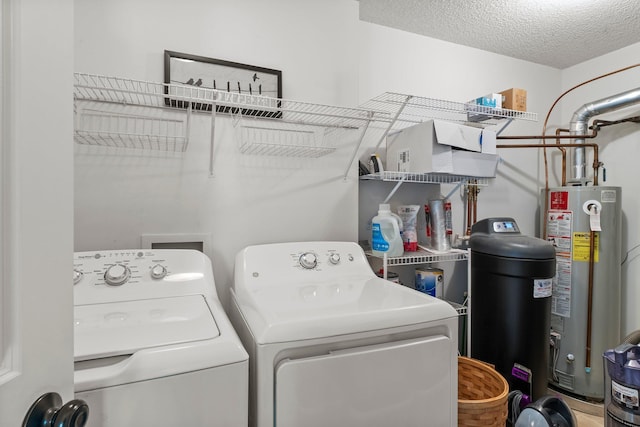 13055 Europa Trail Way N Unit A, Hugo, MN 55038 - laundry area featuring washing machine and clothes dryer, water heater, and a textured ceiling
