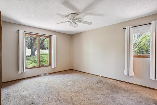 2820 150th St W, Shakopee, MN 55379 - unfurnished room featuring ceiling fan, carpet, baseboards, and a textured ceiling