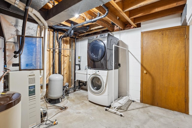 2820 150th St W, Shakopee, MN 55379 - unfinished basement featuring stacked washer / drying machine, a water pressure tank, and concrete block wall