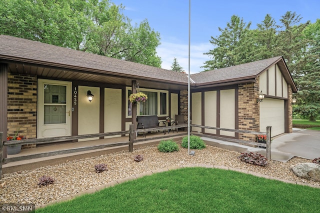 10425 Quaker Ln N, Maple Grove, MN 55369 - ranch-style home with brick siding, a porch, a garage, concrete driveway, and roof with shingles