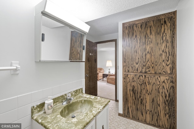 10425 Quaker Ln N, Maple Grove, MN 55369 - bathroom featuring vanity and tile patterned floors