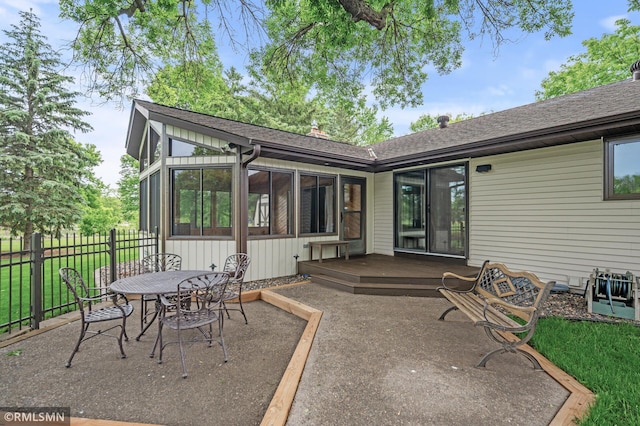 10425 Quaker Ln N, Maple Grove, MN 55369 - view of patio with a wooden deck, a sunroom, and outdoor dining space