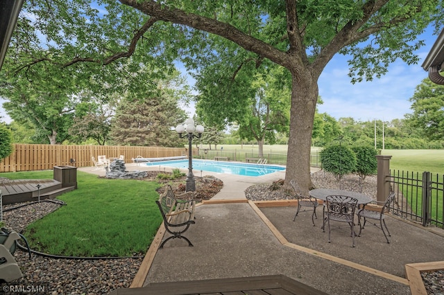 10425 Quaker Ln N, Maple Grove, MN 55369 - view of swimming pool with a patio and view of scattered trees