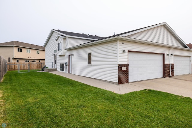 3324 10th St S, Moorhead, MN 56560 - view of property exterior featuring brick siding, concrete driveway, and a garage