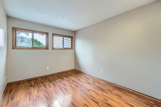 8932 Neill Lake Rd Unit 112B, Eden Prairie, MN 55347 - unfurnished room featuring wood finished floors and baseboards