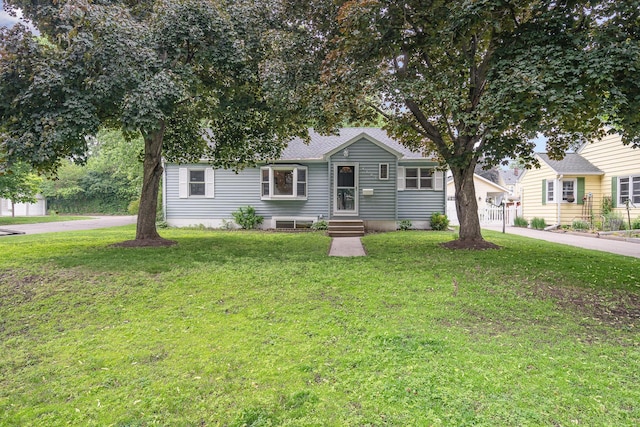 4101 Welcome Ave N, Robbinsdale, MN 55422 - view of front of house featuring a front lawn