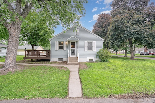 4101 Welcome Ave N, Robbinsdale, MN 55422 - view of front of property with a front lawn and a wooden deck