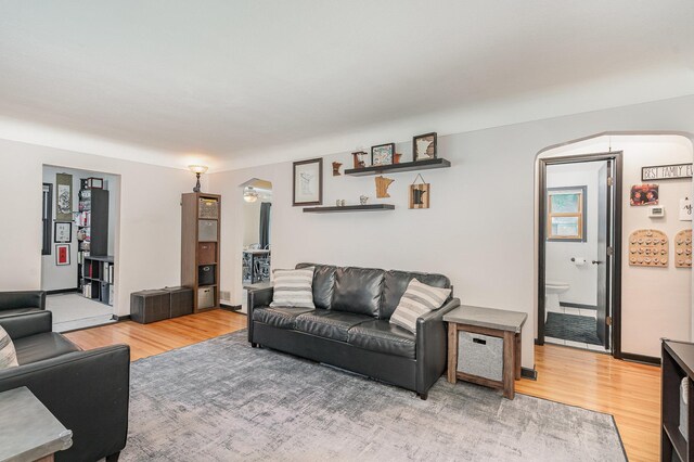 4101 Welcome Ave N, Robbinsdale, MN 55422 - living area featuring light wood-style flooring and arched walkways
