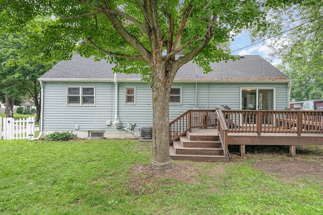 4101 Welcome Ave N, Robbinsdale, MN 55422 - back of property with a deck and a shingled roof