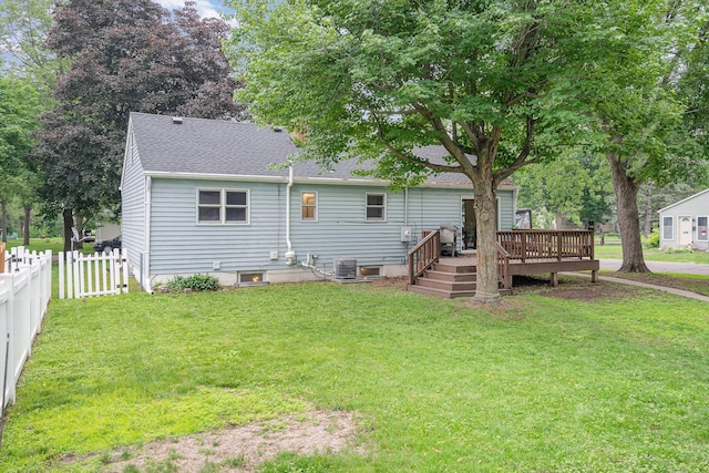 4101 Welcome Ave N, Robbinsdale, MN 55422 - back of property featuring a deck and a shingled roof