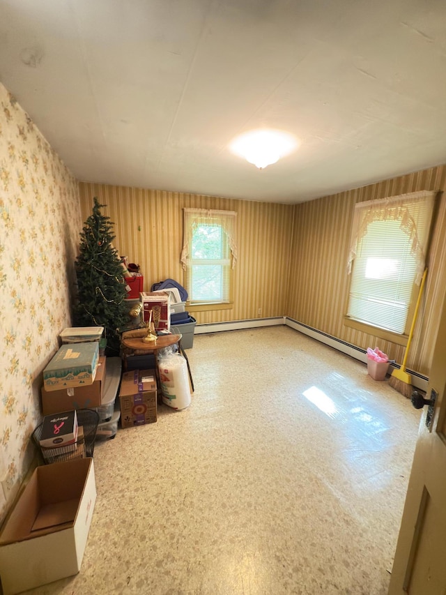 107 3rd Ave, Bellingham, MN 56212 - sitting room featuring wallpapered walls and a baseboard heating unit